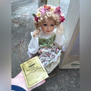 Porcelain Doll with Floral Dress and Bow
